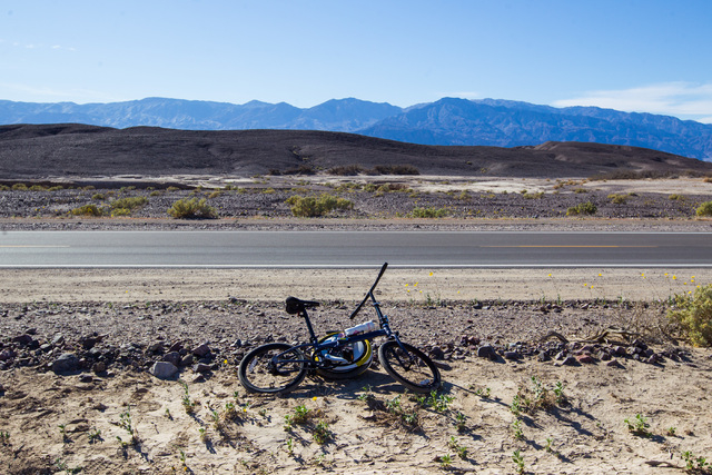 A lone bike sits along California State Route 190 in Death Valley National Park, Calif. on Saturday, Feb. 27, 2016. The National Park Service said in a statement that the "current bloom in Death V ...