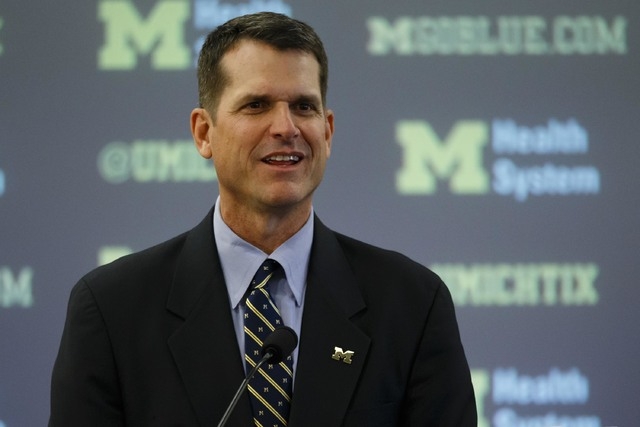 Dec 30, 2014; Ann Arbor, MI, USA; Jim Harbaugh speaks to the media as he is introduced as the new head football coach of the Michigan Wolverines at Jonge Center. (Rick Osentoski-USA TODAY Sports)
