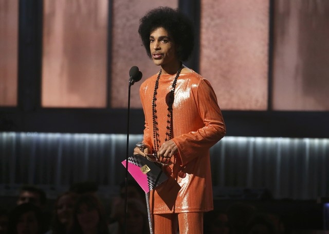 Prince presents the award for album of the year at the 57th annual Grammy Awards in Los Angeles, California February 8, 2015.   REUTERS/Lucy Nicholson