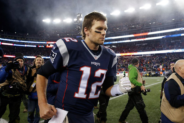 Jan 16, 2016; Foxborough, MA, USA; New England Patriots quarterback Tom Brady (12) runs off the field after defeating the Kansas City Chiefs 27-20 during the second half in the AFC Divisional roun ...