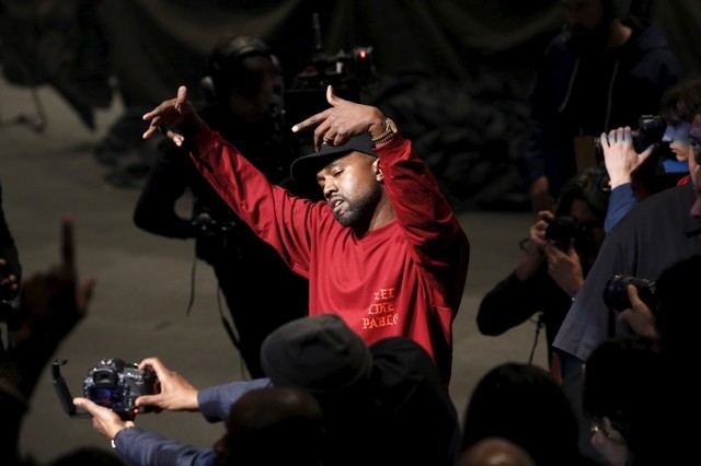 Kanye West dances during his Yeezy Season 3 Collection presentation and listening party for the "The Life of Pablo" album during New York Fashion Week February 11, 2016. (Andrew Kelly/Reuters)