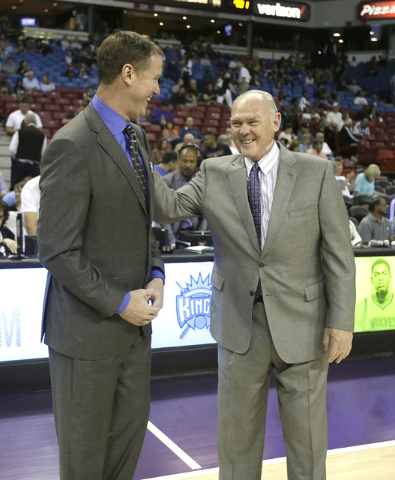 In this photo taken Tuesday, April 5, 2016, Portland Trail Blazers head coach Terry Stotts, left, talks with Sacramento Kings head coach George Karl before an NBA basketball game in Sacramento, Ca ...