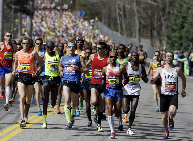 FILE - In this April 21, 2014, file photo, runners compete in the 118th Boston Marathon in Hopkinton, Mass. The 120th running of the historic footrace is scheduled for Monday, April 18, 2016. (AP  ...