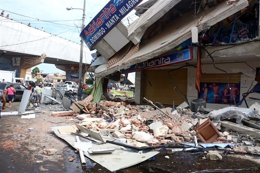 Rubble from a collapsed building lays on the ground in Tarqui, the business district of Manta, Ecuador, Sunday, April 17, 2016. A powerful, 7.8-magnitude earthquake shook Ecuador's central coast o ...