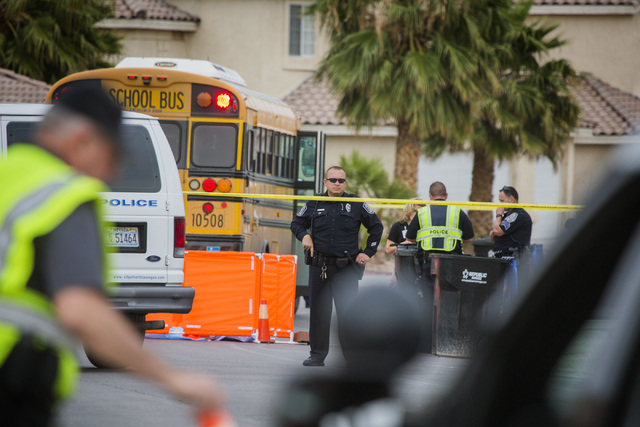 Law enforcement personnel gather near the scene where a toddler was killed Thursday, April 14, 2016 after being struck by a school bus. Jeff Scheid/Las Vegas Review-Journal Follow @jlscheid