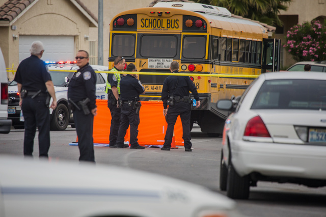 Law enforcement personnel gather near the scene where a toddler was killed Thursday, April 14, 2016 after being struck by a school bus. Jeff Scheid/Las Vegas Review-Journal Follow @jlscheid