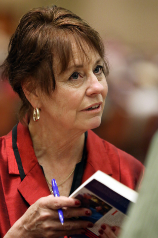 United States Senate candidate Sharron Angle meets with supporters during a book signing and campaigning stop at the Clark County Republican Party county convention at the Rio hotel-casino Saturda ...