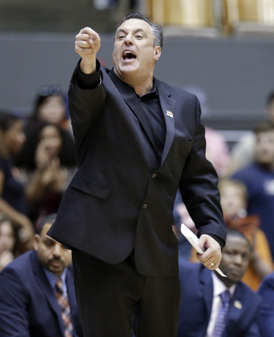 UT Martin head coach Heath Schroyer yells to his team in the first half of an NCAA college basketball game against Austin Peay at the championship of the Ohio Valley Conference basketball tourname ...
