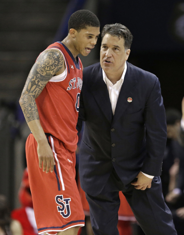 St. John's head coach Steve Lavin, right, talks with Jamal Branch (0) during the second half of an NCAA tournament college basketball game against San Diego State in the Round of 64 in Charlotte, ...