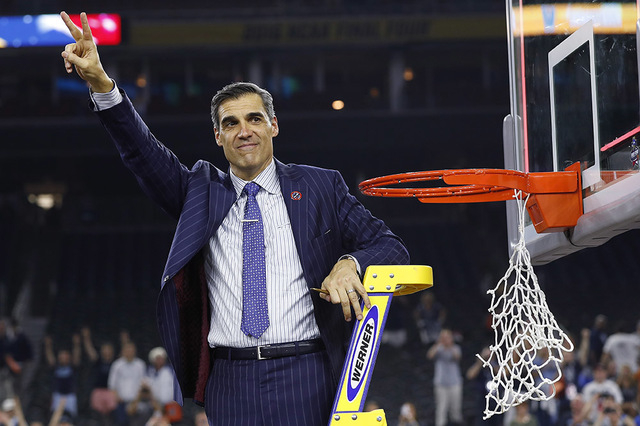 Villanova head coach Jay Wright waved to fans after the NCAA Final Four tournament college basketball championship game against North Carolina, Monday, April 4, 2016, in Houston. Villanova won 77- ...