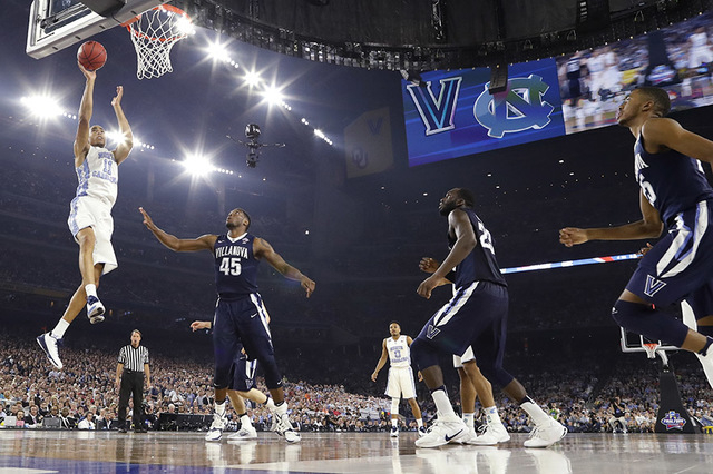 North Carolina's Brice Johnson (11) goes up for a basket during the first half of the NCAA Final Four tournament college basketball championship game against North Carolina, Monday, April 4, 2016, ...