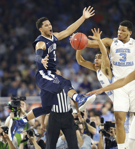 Villanova guard Josh Hart (3) North Carolina guard Marcus Paige (5) and North Carolina forward Kennedy Meeks (3) chase a loose ball during the first half of the NCAA Final Four tournament college ...