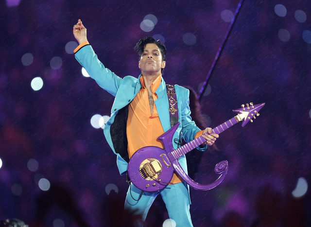 In this Feb. 4, 2007 file photo, Prince performs during the halftime show at the Super Bowl XLI football game at Dolphin Stadium in Miami. (AP Photo/Chris O'Meara, File/AP)