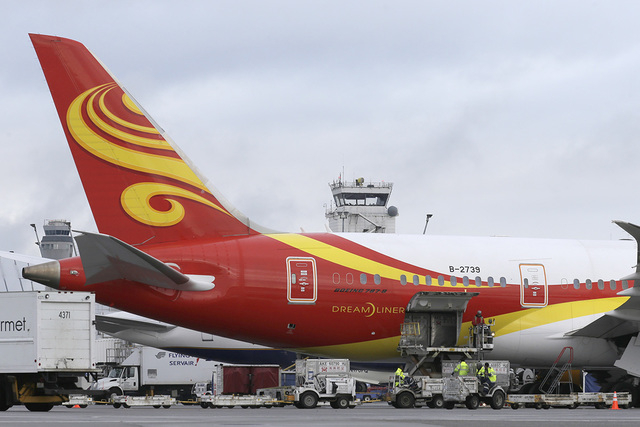 A Boeing 787 operated by Hainan Airlines is loaded with cargo Tuesday, Jan. 26, 2016, at Seattle-Tacoma International Airport in Seattle. (Ted S. Warren/AP)