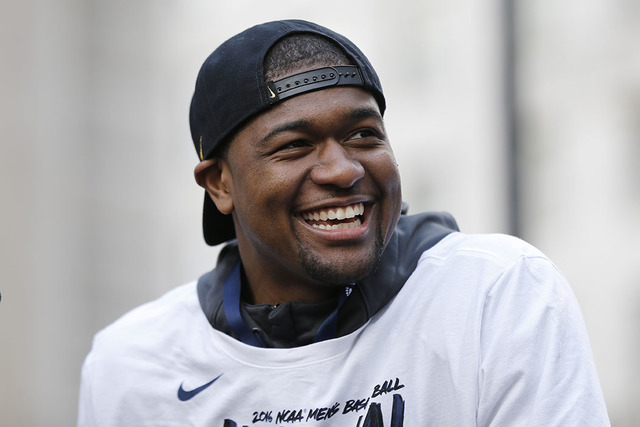 Villanova's Kris Jenkins smiles as he and his basketball teammates take part in a rally celebrating the team's NCAA college basketball championship, Friday, April 8, 2016, in Philadelphia. (AP Pho ...