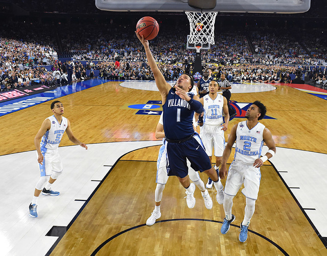 Villanova's Jalen Brunson (1) goes to the basket during the first half of the NCAA Final Four tournament college basketball championship game against North Carolina, Monday, April 4, 2016, in Hous ...