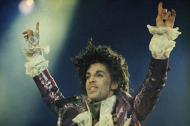 Rock singer Prince performs at the Forum in Inglewood, Calif., during his opening show, Feb. 18, 1985. (AP Photo/Liu Heung Shing)