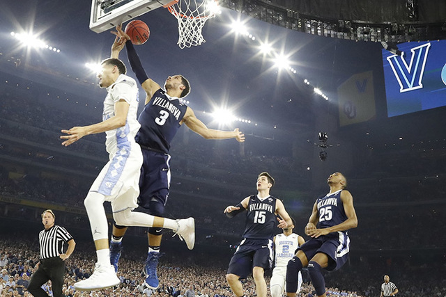 North Carolina forward Justin Jackson (44) shoots against Villanova guard Josh Hart (3) during the first half of the NCAA Final Four tournament college basketball championship game Monday, April 4 ...