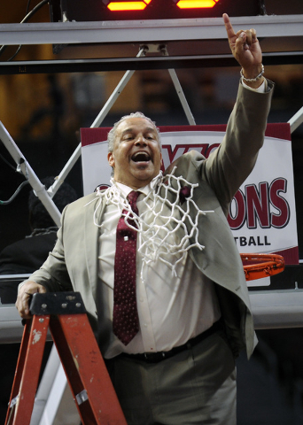 New Mexico State coach Marvin Menzies celebrates after his team defeated Idaho 77-55 in an NCAA college basketball game for the championship in the Western Athletic Conference men's tournament, Sa ...