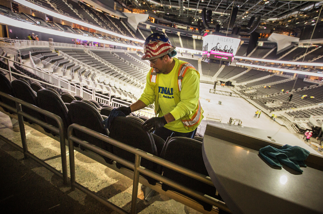 Isaac Vegas with CSI cleans seats at T-Mobile Arena on Monday, March 28, 2016. The Killers will open the arena with a concert on April 6. Jeff Scheid/Las Vegas Review-Journal Follow @jlscheid