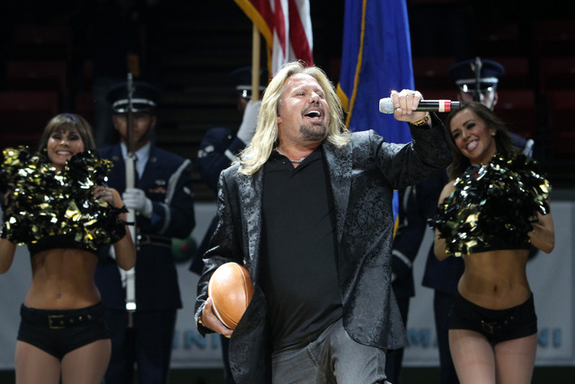 Las Vegas Outlaws owner Vince Neil sings the national anthem before the Outlaws inaugural Arena Football League game against the San Jose SaberCats Monday, March 30, 2015, at the Thomas & Mack ...