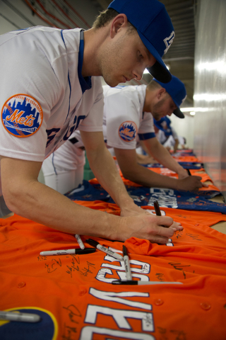 Erik Goeddel (62) signs jerseys during media day for the Las Vegas 51s at Cashman Field in Las Vegas on Tuesday, April 5, 2016. The event was held ahead of opening Thursday's season opener against ...