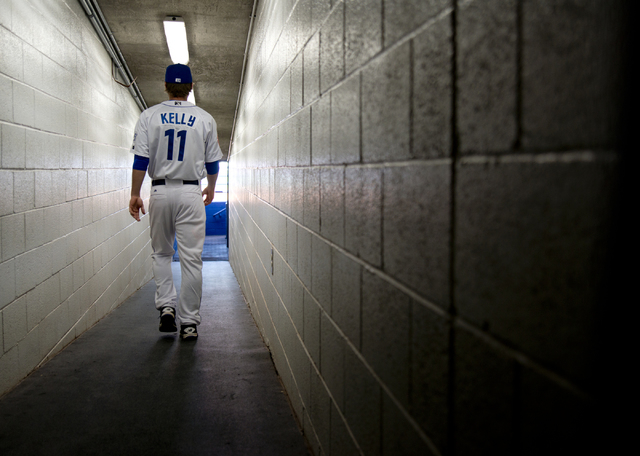 Ty Kelly (11) walks onto the field during media day for the Las Vegas 51s at Cashman Field in Las Vegas on Tuesday, April 5, 2016. The event was held ahead of opening Thursday's season opener agai ...
