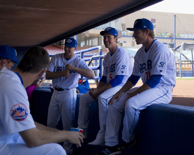Brandon Nimmo (7), from left, Matt Reynolds (5), and Ty Kelly (11) talk with teammates during media day for the Las Vegas 51s at Cashman Field in Las Vegas on Tuesday, April 5, 2016. The event was ...