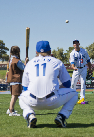 T.J. Rivera (3), and Ty Kelly (11) play with Celeste King, a local Girl Scout, during media day for the Las Vegas 51s at Cashman Field in Las Vegas on Tuesday, April 5, 2016. The event was held ah ...