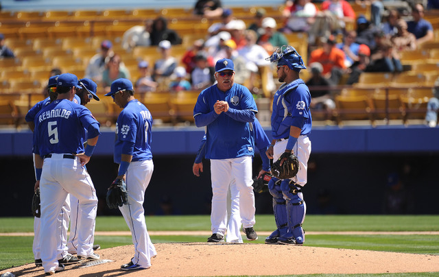 Las Vegas 51s manager Wally Backman, center, is seen on the mound during a pitching change during their Triple-A minor league baseball game against the Albuquerque Isotopes at Cashman Field in Las ...