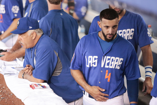 Las Vegas 51s left-fielder Alex Castellanos (4) walks past manager Wally Backman in the dugout during a baseball game against the Salt Lake Bees at Cashman Field in Las Vegas Friday, July 10, 2015 ...