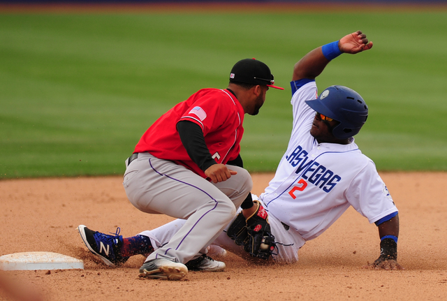 Las Vegas 51s base runner Dilson Herrera is tagged out by Albuquerque second baseman Rafael Ynoa after Herrera tried to steal second base at Cashman Field in Las Vegas Sunday, April 24, 2016. (Jo ...
