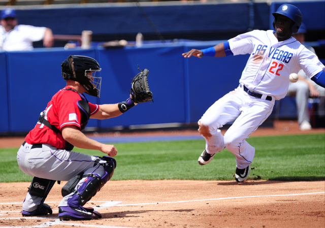 Albuquerque catcher Nick Hundley tags out Las Vegas 51s base runner Roger Bernadina at home plate in the first inning of their Triple-A minor league baseball game at Cashman Field. (Josh Holmberg/ ...