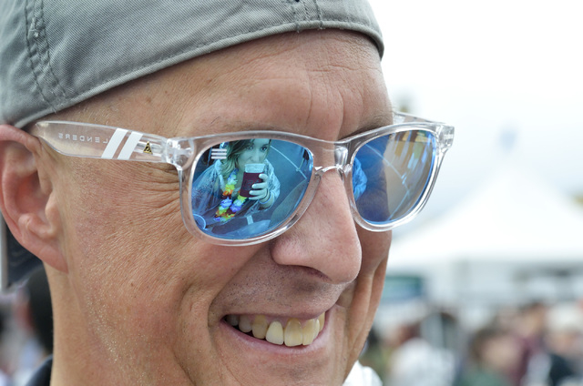Jessica Ernsperger is reflected in her father Tom Ernsperger’s glasses during the Great Vegas Festival of Beer in the 800 block of Fremont Street in Las Vegas on Saturday, April 9, 2016. Bi ...