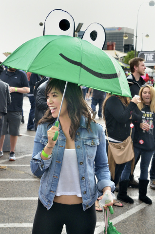 Vivi Avila waits in the line for the Lagunitas Brewing Company during a rainy afternoon at the Great Vegas Festival of Beer in the 800 block of Fremont Street in Las Vegas on Saturday, April 9, 20 ...