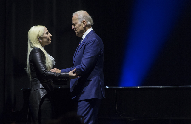 Lady Gaga, left, shares a moment with Vice President Joe Biden after performing "Til It Happens to You" during an event aimed at preventing sexual assault on college campuses in coordination with  ...