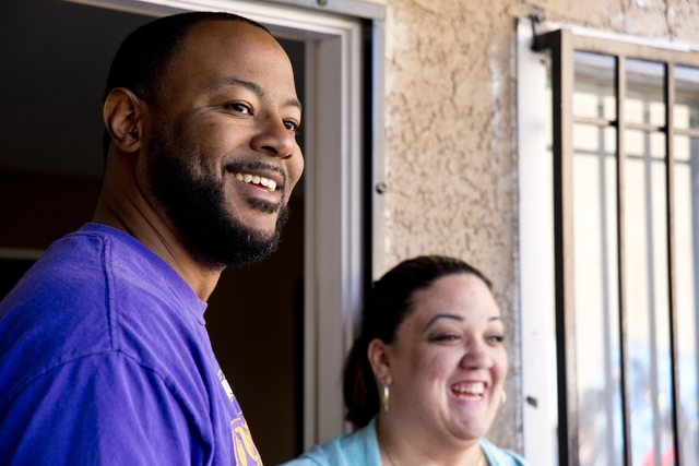 New Genesis Transitional Housing executive director Maurice Page, and Tania Fernandez watch during a volunteer event held by the Gaels Give Hope organization from Bishop Gorman High School, benefi ...