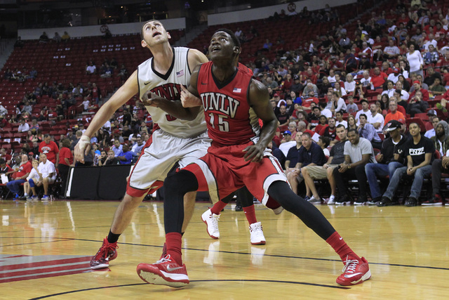 UNLV forwards Ben Carter, left, and Dwayne Morgan jockey for position for a rebound during the annual Scarlet and Gray scrimmage, Thursday, Oct. 16, 2014, at the Thomas & Mack Center. (Sam Mor ...