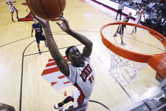 UNLV forward Goodluck Okonoboh drives in for a basket against UNR during their Mountain West Conference basketball game Wednesday, Jan. 7, 2015, at the Thomas & Mack Center. UNR won the game 6 ...