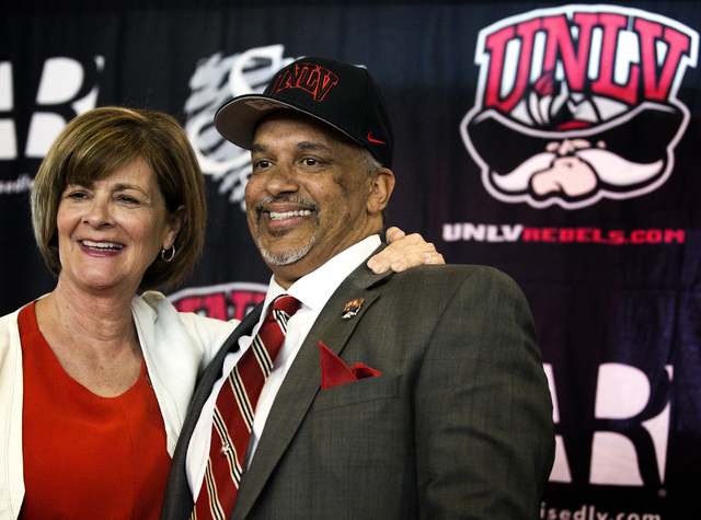 UNLV Director of Athletics Tina Kunzer-Murphy, left, introduces new UNLV men's basketball coach Marvin Menzies during a press conference at Mendenhall Center on Friday, April 22, 2016. Jeff Schei ...