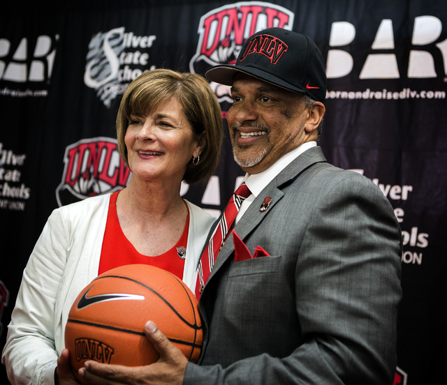 UNLV Director of Athletics Tina Kunzer-Murphy, left, introduces new UNLV men's basketball coach Marvin Menzies during a press conference at Mendenhall Center on Friday, April 22, 2016. Jeff Schei ...