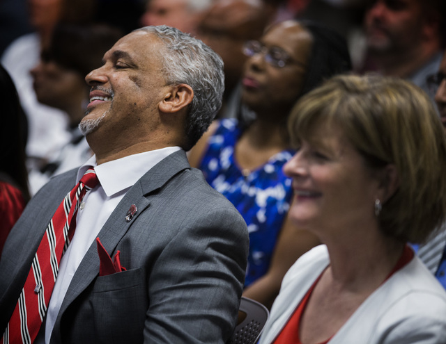 New UNLV men's basketball coach Marvin Menzies,left, and Tina Murphy-Kunzel smile after the University of Nevada Board of Regents approved his contract on Friday, April 22, 2016. Jeff Scheid/Las V ...
