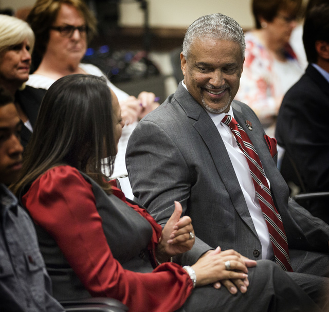 New UNLV men's basketball coach Marvin Menzies,right, gets a thumps up from his wife Tammy after the University of Nevada Board of Regents approved his contract on Friday, April 22, 2016. Jeff Sc ...