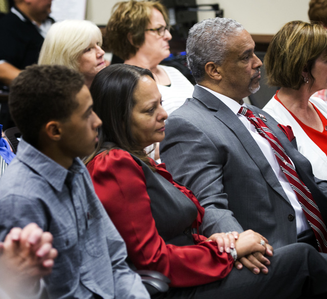 New UNLV men's basketball coach Marvin Menzies,right, and his wife Tammy holds hands while the University of Nevada Board of Regents approved his contract on Friday, April 22, 2016. Jeff Scheid/La ...
