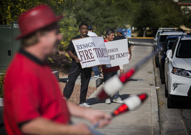 Protestors demonstrate in from University of Nevada Board of Regents building, Friday, April 22, 2016, before a hearing to approve new UNLV men's basketball coach Marvin Menzies contract. Jeff Sch ...