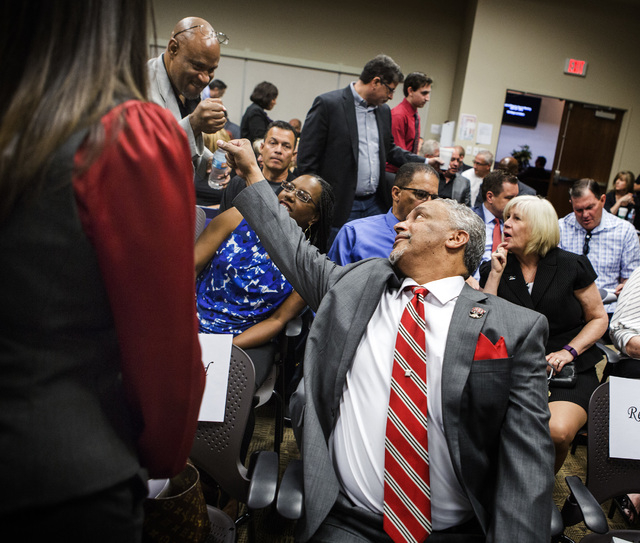 New UNLV men's basketball coach Marvin Menzies fists a supporter before the University of Nevada Board Regents approved his contract on Friday, April 22, 2016. Jeff Scheid/Las Vegas Review-Journal ...