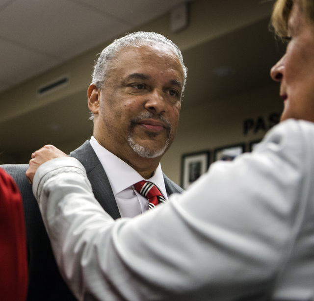 New UNLV men's basketball coach Marvin Menzies,left, and Tina Murphy-Kunzel talk before the University of Nevada Board of Regents approved his contract on Friday, April 22, 2016. Jeff Scheid/Las V ...
