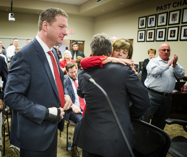 New UNLV basketball coach Chris Beard, left, stands after   University of Nevada Board of Regents approved his contract Friday, April 8, 2016. On the right is UNLV Director of Athletics Tina Kunze ...