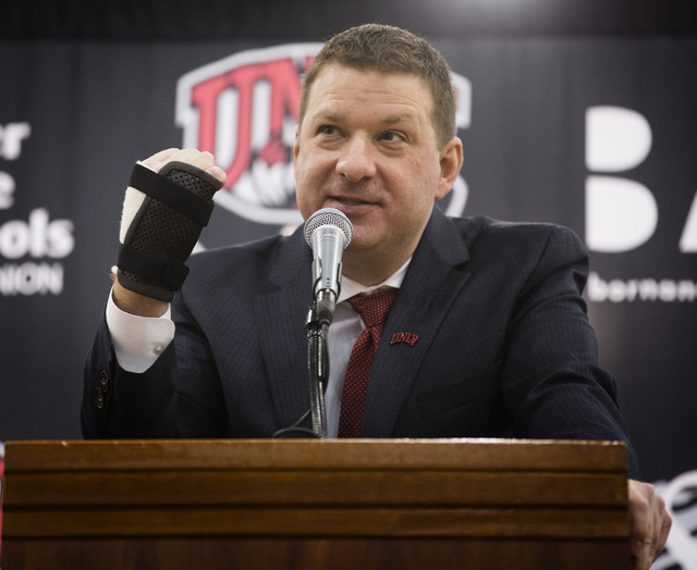 New UNLV basketball coach Chris Beard holds up his broken hand while talking about his passion for basketball during a press conference at Mendenhall Center on Friday, April 8,2016. Jeff Scheid/La ...
