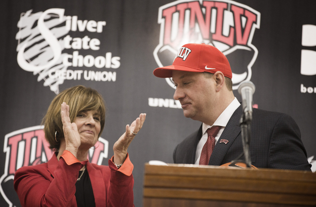 UNLV Director of Athletics Tina Kunzer-Murphy, left, applauds after introducing new UNLV basketball coach Chris Beard during a press conference at Mendenhall Center in Las Vegas on Friday, April 8 ...